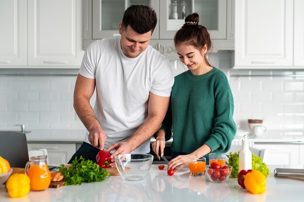 young-couple-cooking-healthy-meal-preparation-fitnesshub-fitnesshub24x7